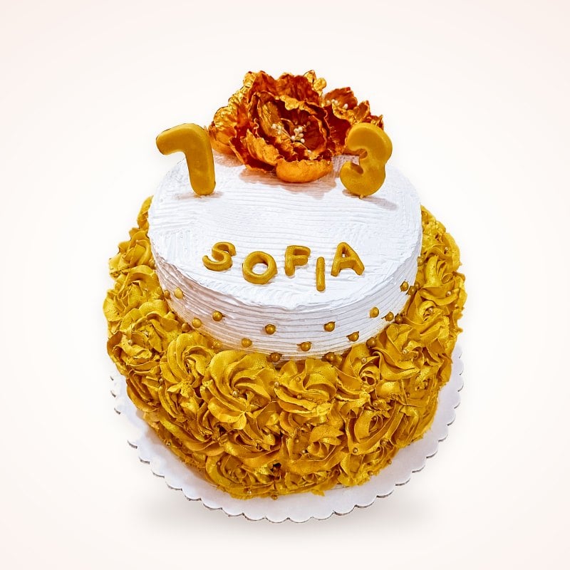 Torta de rosetones dorados con el nombre Sofía